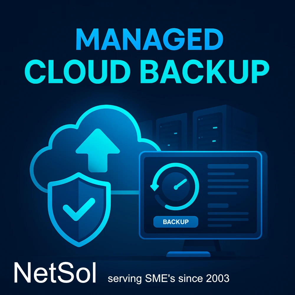 Technician monitoring data backup status on multiple screens in a server room